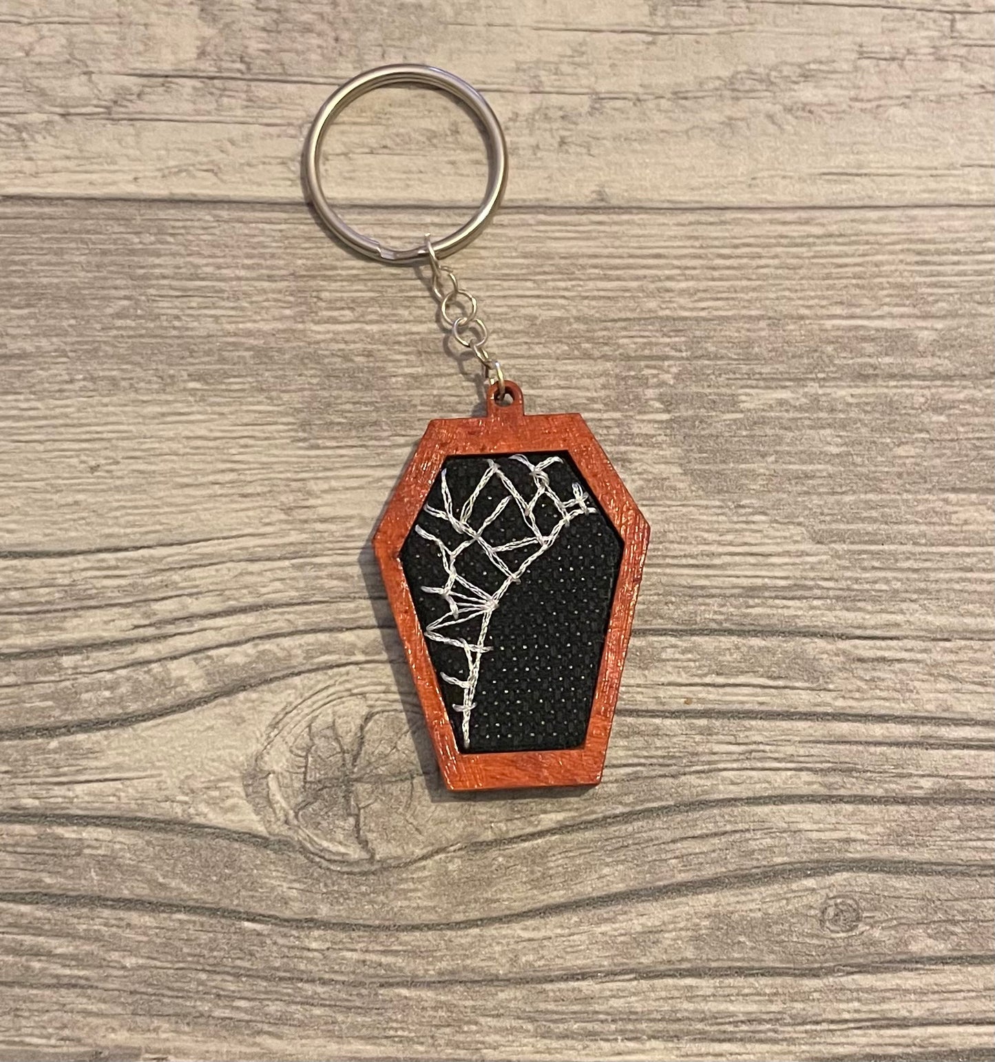 Spiderweb coffin keychain