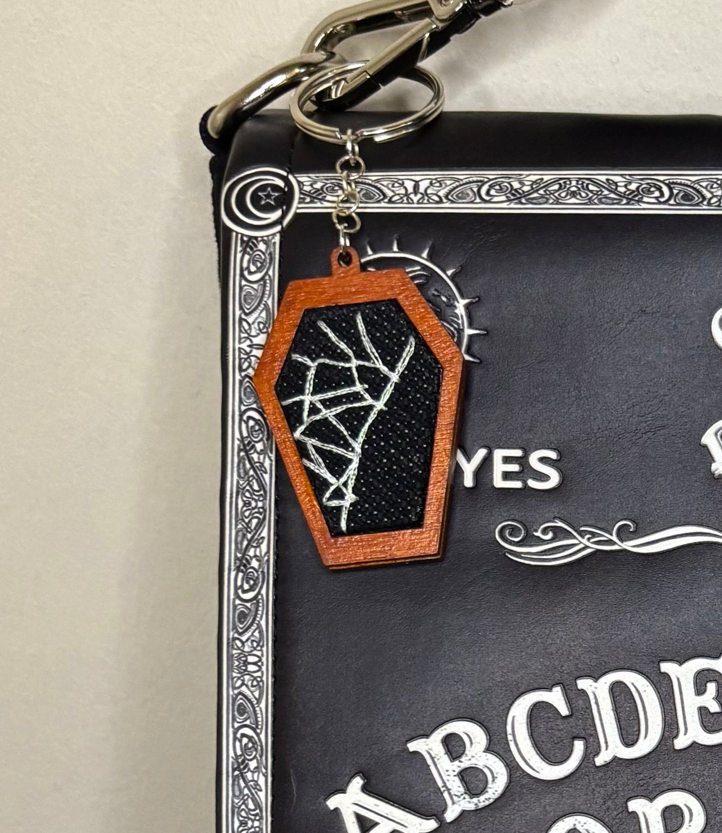 Spiderweb coffin keychain